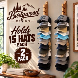 May include: Two vertical wooden wall-mounted hat racks, each holding 15 baseball caps in various colors including grey, tan, blue, and black. The wall features text reading Burlywood Design, Holds 15 Hats Each, and 2 Pack with a mountain graphic.