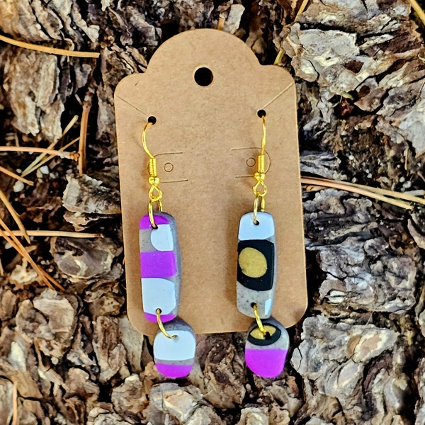 Handmade polymer clay dangle earrings. Purple, gold, black, white, stone. Conversation starter. Interesting designs. Statement jewelry.