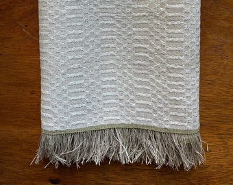 Handwoven linen tea towel in m’s and o’s