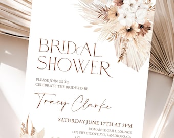 May include: A beige bridal shower invitation with a watercolor illustration of dried flowers and pampas grass. The text reads "Bridal Shower", "Please join us to celebrate the bride-to-be Tracy Clarke", "Saturday June 17th at 3pm", "Romance Grill Lounge", "1875 Sweetlove Ave, San Diego, CA", "RSVP to Katie at 123.456.789".