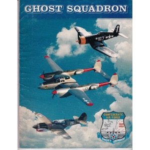 May include: A vintage poster titled "Ghost Squadron" featuring three military aircraft against a blue sky with clouds. The poster includes the Confederate Air Force emblem and the years 1939-1945.