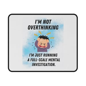 May include: White rectangular mousepad with a black border. The mousepad features the text "I'M NOT OVERTHINKING" above an illustration of a stressed person. Below the illustration, the text reads "I'M JUST RUNNING A FULL-SCALE MENTAL INVESTIGATION."