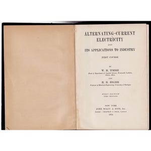 May include: An open book titled "ALTERNATING-CURRENT ELECTRICITY AND ITS APPLICATIONS TO INDUSTRY." The cover is cream-colored with black text. The book is a first edition from 1914, published by John Wiley & Sons, Inc.