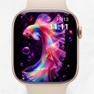 May include: A smartwatch with a light beige band and a rose gold frame. The digital display shows a vibrant, multi-colored betta fish with flowing fins against a dark background with bubbles. The screen displays the text FRI13 and the time 11:11.