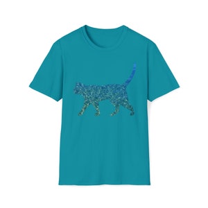 May include: Teal t-shirt with a cat silhouette filled with a blue and green water pattern. The cat is shown walking, tail up. The shirt has short sleeves and a crew neck.