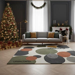 May include: A festive living room with a decorated Christmas tree, a grey sofa with cushions, and a patterned rug. The rug features large, colourful circular designs in green, orange, and grey. The room is decorated for Christmas.