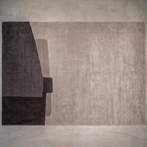 Soft taupe modern wool area rug, muted geometric blocks, suitable for minimalist or mid century rooms