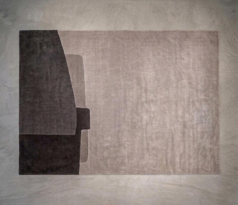 Soft taupe modern wool area rug, muted geometric blocks, suitable for minimalist or mid century rooms