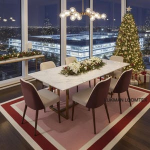 Evening dining with skyline view, pink wool area rug frames table, deep rose border adds drama.