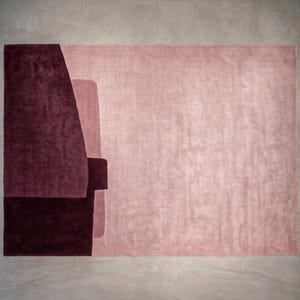 Rose and wine tones, contemporary living room rug option, plush hand tufted wool with carved seams