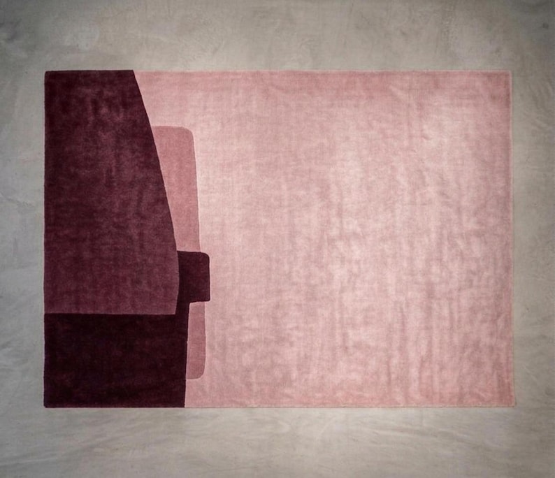 Rose and wine tones, contemporary living room rug option, plush hand tufted wool with carved seams