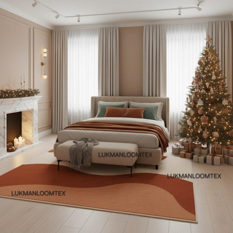 May include: A bedroom scene with a bed, bench, and area rug. The bed has a neutral headboard and is covered with a brown blanket and pillows. A Christmas tree is lit with lights. The rug has a wave design in shades of orange.