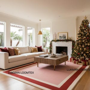 Contemporary living room by fireplace, pink wool area rug adds plush, luxury modern rug warmth.