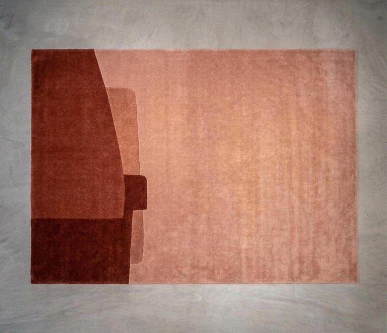 Soft blush terracotta modern wool area rug, muted peach blocks, hand tufted plush pile and carving