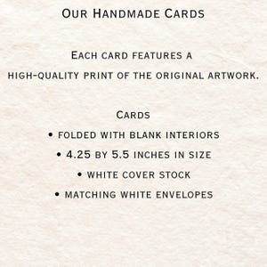 May include: Our Handmade Cards text with bullet points describing the card features: folded with blank interiors, 4.25 by 5.5 inches in size, white cover stock, and matching white envelopes.