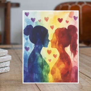 May include: Watercolor painting of two women facing each other. They are silhouetted against a rainbow background with hearts scattered around them.