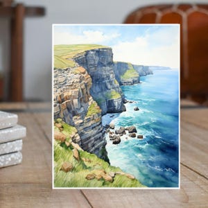 May include: A watercolor painting of a cliffside overlooking a blue ocean. The cliffs are a mix of gray and brown, with green grass growing on the top. The ocean is a deep blue, with white waves crashing against the rocks.