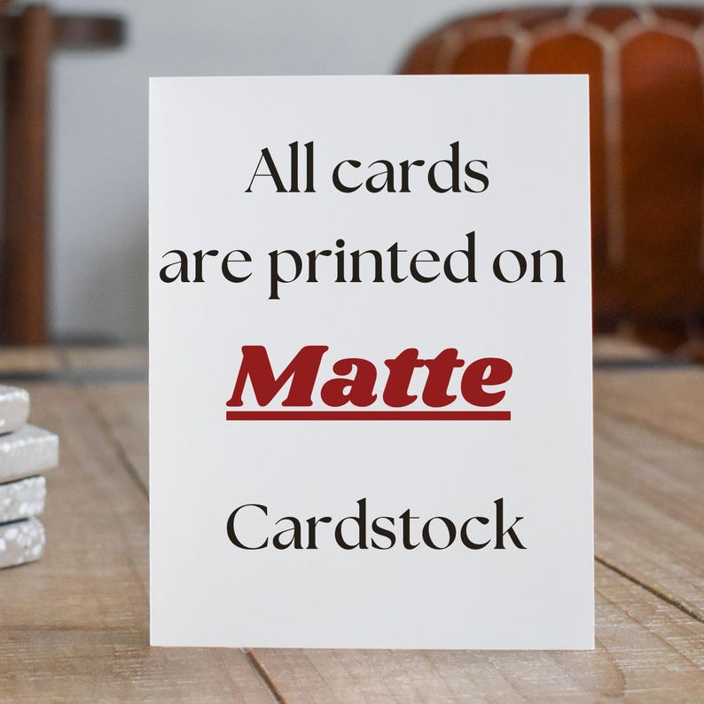 May include: White card with black text that reads "All cards are printed on Matte Cardstock". The word "Matte" is in red.