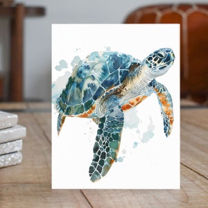 May include: Watercolor painting of a sea turtle with a blue, green, and orange shell swimming in a white background with blue and gray watercolor splatters.