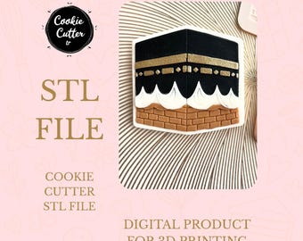 May include: A cookie cutter in the shape of the Kaaba, with a black top, gold accents, and a brick-like base. The image includes the text "STL FILE" and "DIGITAL PRODUCT FOR 3D PRINTING".