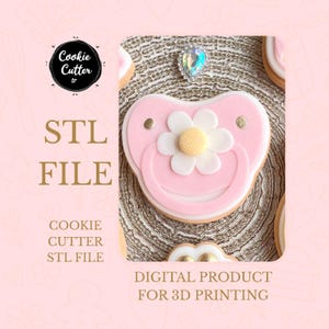 May include: A pink pacifier-shaped cookie with a white flower and gold accents. The image includes text that reads "STL FILE" and "DIGITAL PRODUCT FOR 3D PRINTING". The cookie is part of a set of cookies.