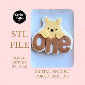 May include: A light yellow bear-shaped cookie cutter with the word "one" in brown. The image also includes the text "STL FILE" and "DIGITAL PRODUCT FOR 3D PRINTING". The cookie cutter is designed for 3D printing.