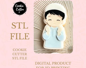 May include: A light blue cookie cutter in the shape of a cartoon boy wearing a white cap. The image includes the text "STL FILE" and "DIGITAL PRODUCT FOR 3D PRINTING". The cookie cutter is a digital product.
