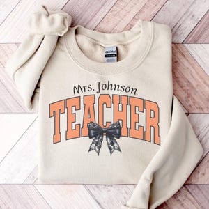 Personalized Teacher Halloween Sweatshirt: Retro Pumpkin Design