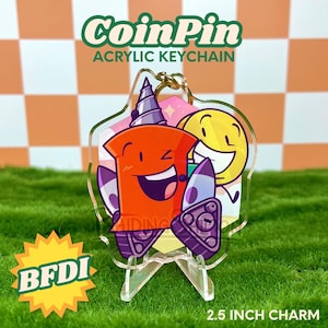 May include: Clear acrylic keychain featuring two cartoon characters. One is orange with a drill bit and purple accents, the other is yellow. The keychain has the text "CoinPin" and "Acrylic Keychain". The charm is 2.5 inches.