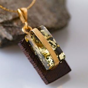 Amber & Gold. Designer pendant. Artistic amber pendant with wood. Sterling silver setting. Covered by 14 ct gold. Hand made pendant. Unique.