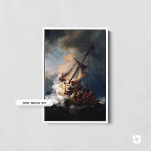 May include: A painting of a ship caught in a storm, with a bright light shining through the dark clouds. The ship is filled with people, and the waves are crashing around it. The painting is framed in a white floating frame.