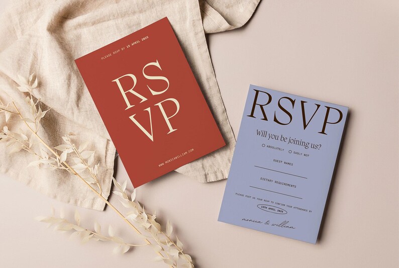 May include: Two RSVP cards, one red with white text and the other blue with black text. The red card says "RSVP" in large letters and the blue card says "RSVP Will you be joining us?" with a check box for "Absolutely!" and "Sadly not".