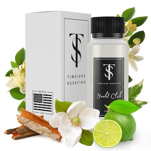 May include: A clear glass bottle with a black cap and a white label that says "Timeless Scenting Yacht Club Fragrance". The bottle is surrounded by white flowers, green leaves, and cinnamon sticks.