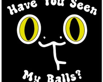May include: Black square with a cartoon cat face and the text "Have You Seen My Balls?" in white, rounded letters. The cat has yellow eyes with white outlines.