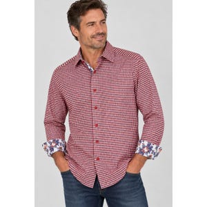 May include: A long-sleeved button-down shirt featuring a red and white gingham check pattern. The shirt has a classic collar and contrasting cuffs with a blue, red, and white floral print pattern. The shirt is paired with dark blue denim jeans.