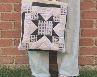 Sac fourre-tout noir et blanc matelassé en patchwork