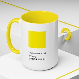 May include: White ceramic mug with a yellow interior, handle, and a yellow square graphic. The mug has the text "YOUR NAME HERE", the hex code "#ffff00", and the RGB value "rgb (255, 255, 0)" printed on the side.