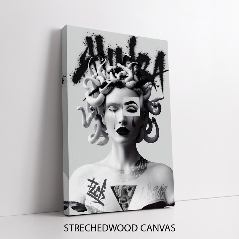 May include: Black and white illustration of Medusa with a snake head and a tattoo on her chest. The word "AURA" is spray painted on the wall behind her.