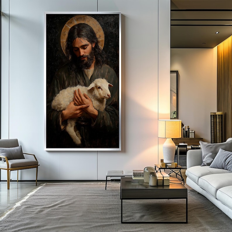 May include: A painting of a man holding a white lamb in his arms. The man is wearing a dark robe and has a halo above his head. The background is dark and the painting is framed in a white frame.