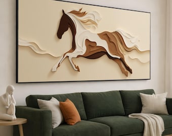 May include: A framed wall art piece featuring a layered paper horse in shades of brown, white, and beige. The horse is depicted mid-gallop against a light beige background. The artwork is framed in a black rectangular frame.