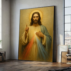 Pode incluir: Uma obra de arte religiosa emoldurada retratando uma figura com cabelos longos castanhos, barba e auréola. A figura usa uma túnica creme com uma capa azul e verde. Raios vermelhos e azuis emanam do peito da figura. A obra de arte é exibida em uma sala com uma janela.