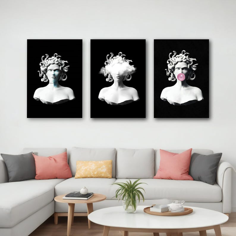 May include: Triptych of Medusa busts on black backgrounds. The busts are white, with snake-like hair. One has a cloud in place of a face, and another has a bubblegum bubble. The art is displayed above a white couch with colorful pillows.