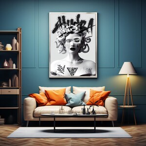 May include: A black and white illustration of Medusa, a mythical Greek creature with snakes for hair, with the word "AURA" written in graffiti style above her head. The image is framed and hanging on a teal wall above a white couch with orange and blue pillows.