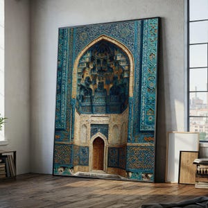 May include: Large framed print of an ornate archway with intricate blue and gold tilework. The artwork depicts a detailed architectural design with a wooden door at the base. The print is displayed on a wooden floor.