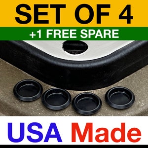 May include: Set of four black plastic door handle covers with one spare. The text "SET OF 4 +1 FREE SPARE" is at the top of the image. The text "USA Made" is at the bottom of the image.