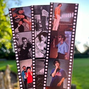 May include: A set of three bookmarks featuring black and white photos of a band. The bookmarks are designed to look like film strips with a black border and white perforations.