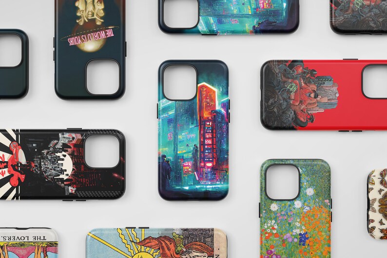 May include: Assortment of phone cases with various designs, including a cityscape, a red and black graphic, a floral pattern, and a tarot card. The cases are all black with a clear window for the camera lens.