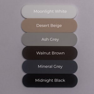 Puede incluir: Seis muestras de pintura, de arriba a abajo: Blanco Moonlight, Beige Desierto, Gris Ceniza, Marr&oacute;n Nogal, Gris Mineral, Negro Medianoche.