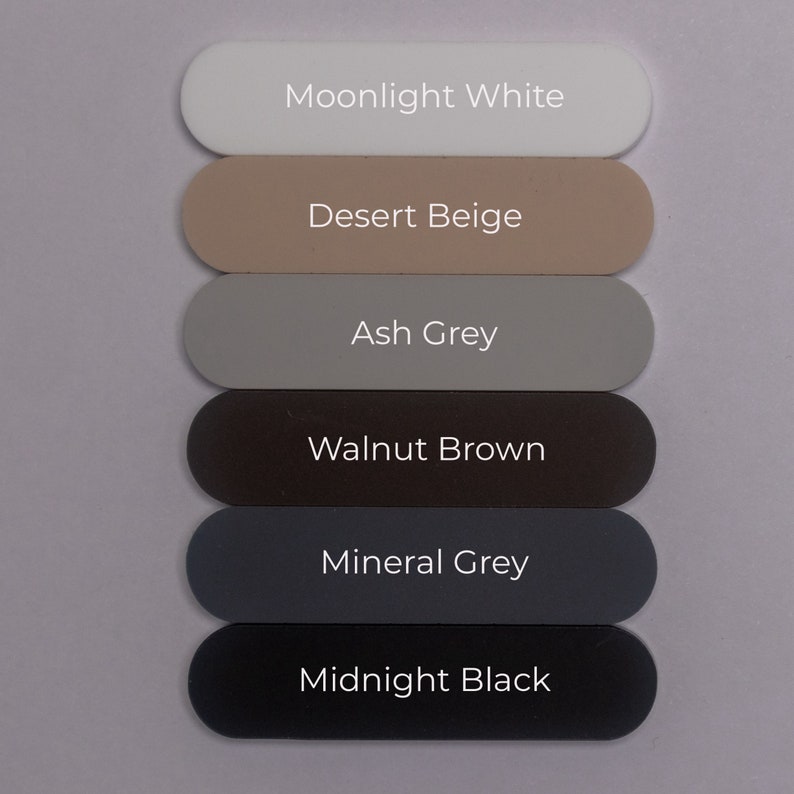 Puede incluir: Seis muestras de pintura, de arriba a abajo: Blanco Moonlight, Beige Desierto, Gris Ceniza, Marr&oacute;n Nogal, Gris Mineral, Negro Medianoche.