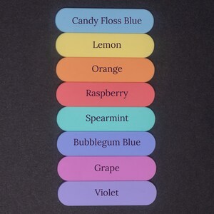May include: Eight colorful, rectangular, flat, plastic pieces stacked vertically. Each piece has a different color and a name printed on it: Candy Floss Blue, Lemon, Orange, Raspberry, Spearmint, Bubblegum Blue, Grape, and Violet.